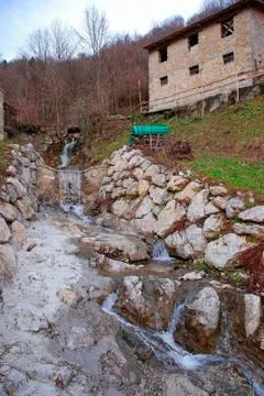 Rural Building by Stream Stock Photos