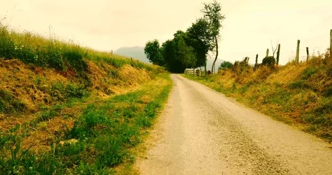 Rural dirt road between fields in the Pyrenees Stock Footage 94497663