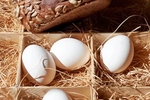 Rural Easter breakfast with eggs and fresh baked bread Stock Photos