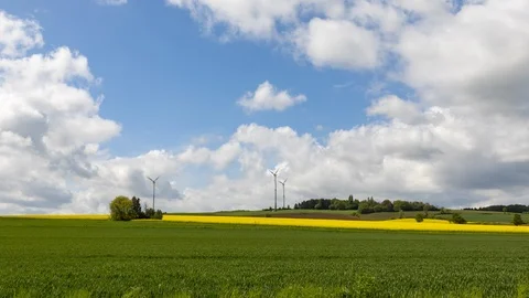 Rural fields and wind energy time lapse Stockbeeldmateriaal 122499028