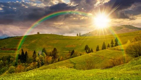 Rural fields on hills on cloudy day Stock Photos