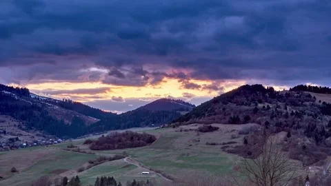 Rural hilly spring landscape, dense clouds with fast movement, colors at blue Stock Footage 185561044