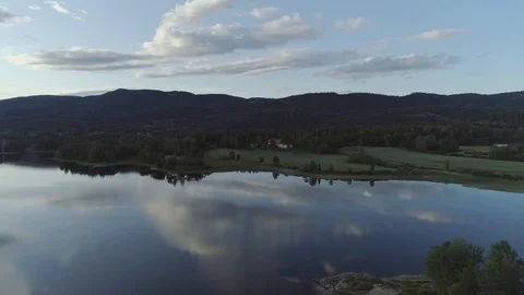 Rural idyllic lake reflecting the clouds Stock Footage 113339692
