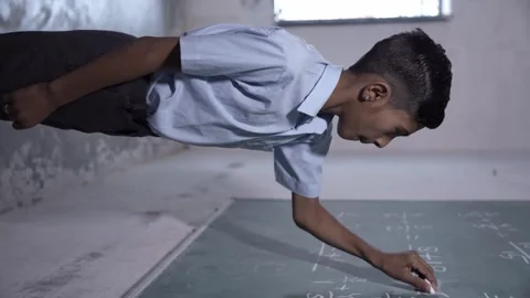 Rural indian student write solve math sum on chalkboard or blackboard in cl.. Stock Footage 274334675