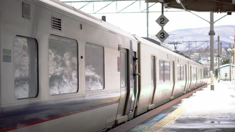 Rural Japanese Train Station - Train Doors Closing and Then Departing - Stock Footage 101002124