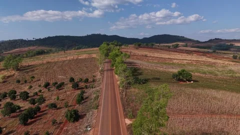 Rural Landscape Aerial View with Fields, Village Homes and Mountain Horizon Stock Footage 328276954