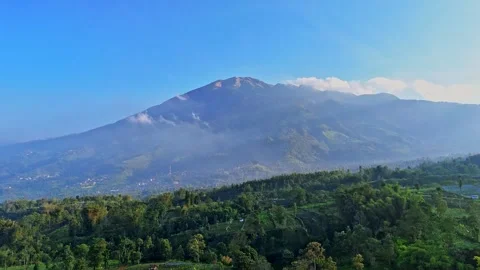 The rural landscape of Central Java with the dormant stratovolcano Merbabu Stock Footage 289502259