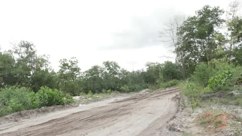 Rural landscape on cloudy day with empty dirt wet road Stock Footage 160303317