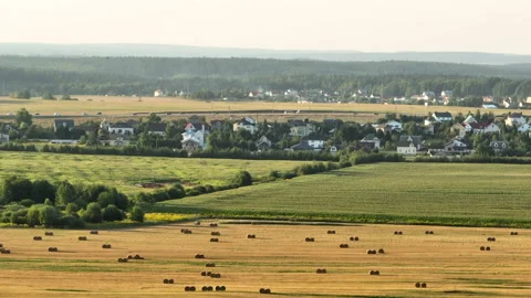 Rural landscape, drone view. Haystack and Hay in rolls at field. Stock Footage 220098837