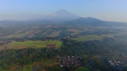 Rural landscape of Java Island, Indonesia with Mount Sumbing and Sindoro Stock Footage 151935617