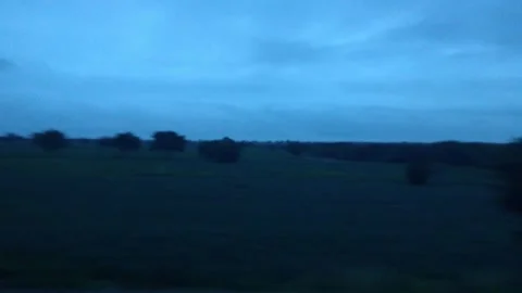 Rural landscape of Karnataka, India, with fields, trees, and a river under .. Stock Footage 341352477