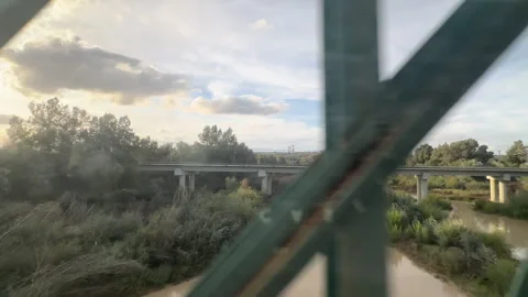 Rural landscape with a muddy river and concrete bridge ,Seville, Spain Stock Footage 337070502