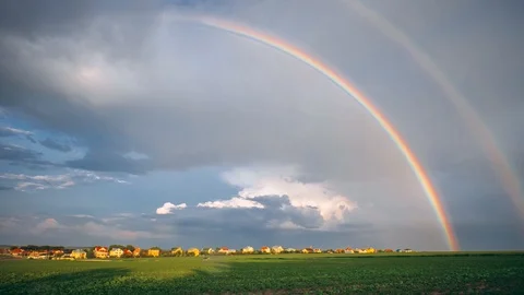 Rural landscape, rain clouds and rainbow, time-lapse. Stock Footage 109181983