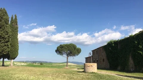 Rural landscape right left panview in 4K of a small Chapel with cypresses trees Stock Footage 80155913