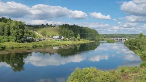 Rural landscape on the river in summer with clouds Stock Footage 247706751