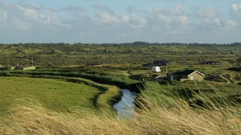 Rural landscape with small river and houses Stock Footage 338088593