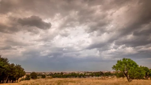 Rural landscape time lapse with fast moving clouds in extreme weather conditions Stock Footage 242582824