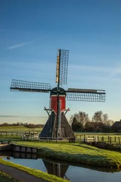 Rural landscape with a windmill Stock Photos