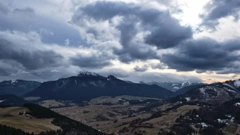 Rural mountain landscape between winter and spring, Cloudy weather, Clouds Stock-Footage 264522290