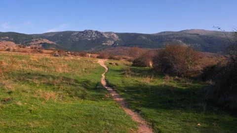 Rural Path Through Autumn Fields and Mountains Stock Footage 293154242