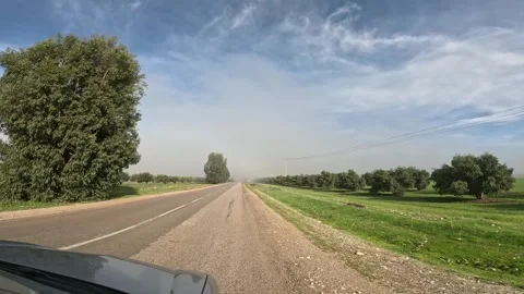 Rural Paved Road Through Green Farmland With Trees, Warning Sign, Utility Stock Footage 345655011