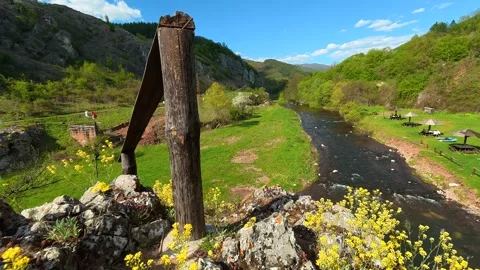 Rural river flows through lush green valley. Balkan, Eastern Europe, POV 스톡 동영상 333590438