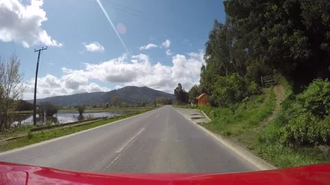Rural Road After Rain with Clouds Viewed from Pickup Hood Stock Footage 306767615