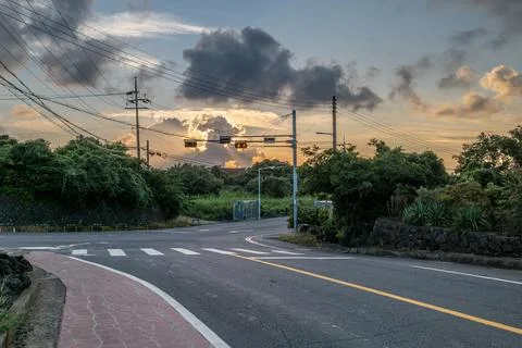 Rural Road Intersection at Sunset with Power Lines Stock Photos
