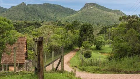 Rural road up to the mountain Stock Photos