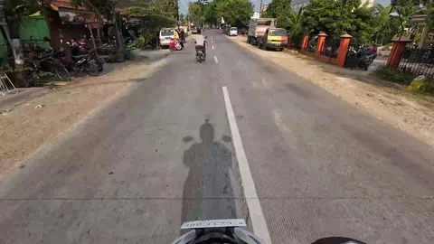Rural road scene passing through small city, Pati district, Central Java Stock-Footage 335131543
