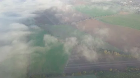 Rural scene. Flying through the clouds above mountain tops. Stock Footage 142223429