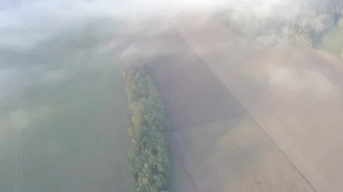 Rural scene. Flying through the clouds above mountain tops. Stock Footage 142224353