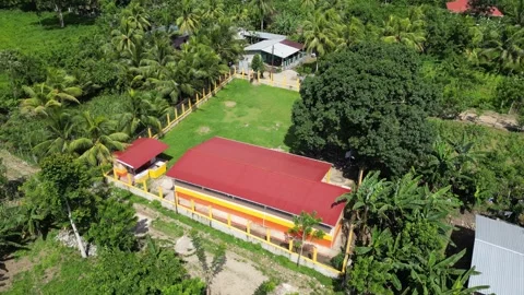 Rural school in Honduras with a simple classroom building, Community Development Stock Footage 328064439