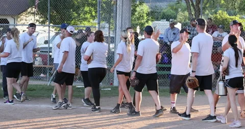 Rural softball players congratulate after game 4K Stock Footage 201772338