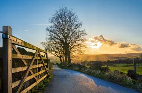 Rural Yorkshire road in winter at sunset. Stock Photos