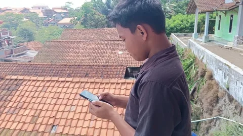 Rural Youth Using Smartphone Technology Outdoors Stock Footage 316976749