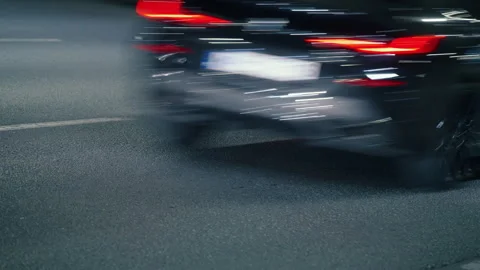 Rush drive in city at night, bright light trails from vehicles, traffic lights Stock Footage 284577950