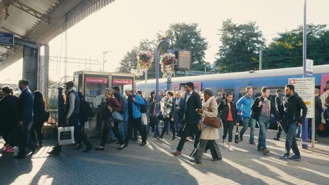 Rush hour crowd in the morning on train station platform heading to the tube  Stock Footage 88955834