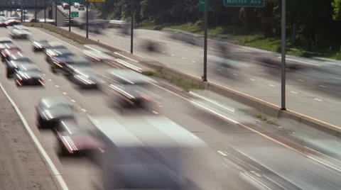 Rush hour daylight time lapse of cars streaking by Stock Footage 52883220
