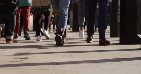 Rush hour feet of people walking on a busy street. Shot on RED Epic in slow mo Stock Footage