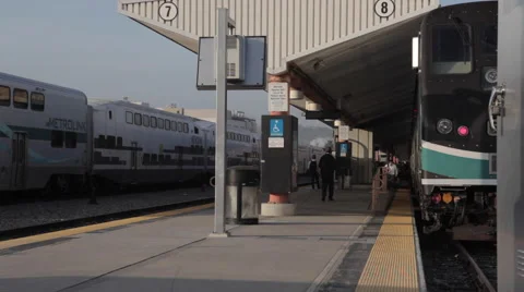Rush hour passenger running to amtrak metrolink surfrider train Stock Footage 61064553