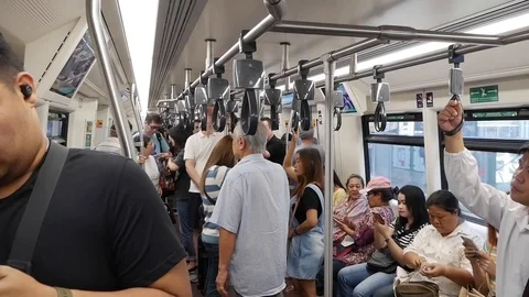 Rush hour on the Sky Train or BTS is an elevated rapid railway system. BANGKOK Stock Footage 124113431