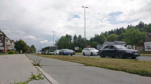 Rush hour slow moving traffic with cyclists driving by Stock Footage 132924542