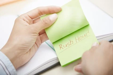 Rush hour text on adhesive note Stock Photos