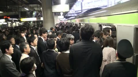 Rush hour Tokyo - passengers enter the carriage (handheld) Stock-Footage 20454749