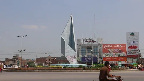 Rush hour traffic at Chan Da Qila square Gujranwala Stock Footage 86626125
