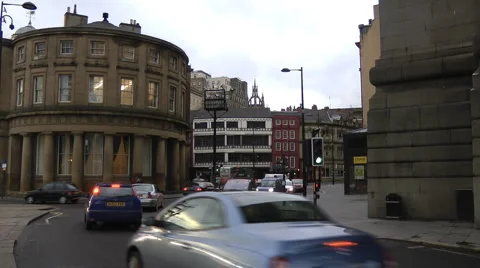 Rush hour traffic at the Guild Hall corner on Newcastle Quayside. Stock Footage 1101621