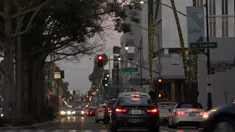 Rush hour traffic intersecting on Wilshire Blvd at golden hour, Los Angeles Stock Footage 124182344