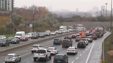 Rush hour traffic jam and gridlock in the City of Toronto in the rain Stock Footage 56859347