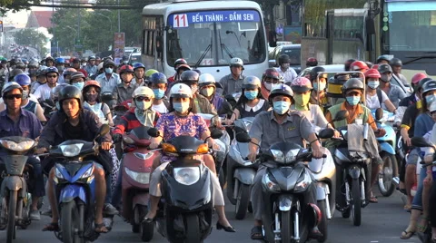 Rush hour traffic in Saigon, busy intersection, motorbikes, street, Vietnam Stock Footage